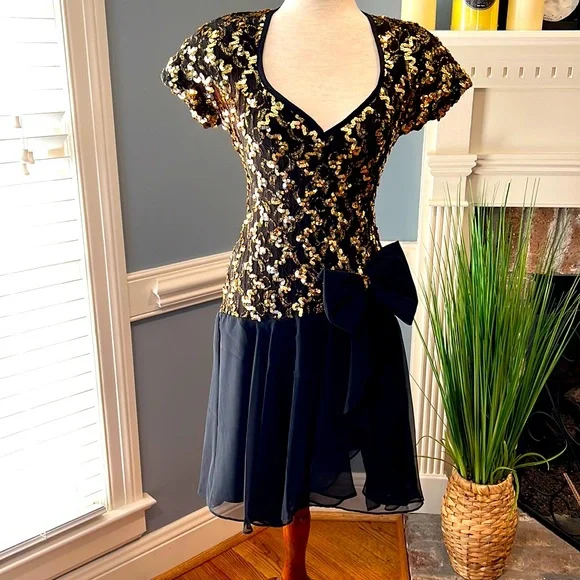 gold sequin dress black bow Black and gold sequin dress with oversize bow 18